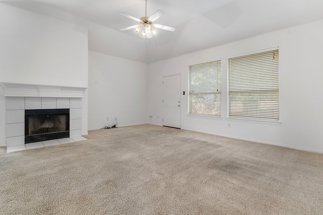 6716 Armstrong Ct, Fort Worth, TX 76137 - unfurnished living room with light carpet, a ceiling fan, a tile fireplace, and vaulted ceiling