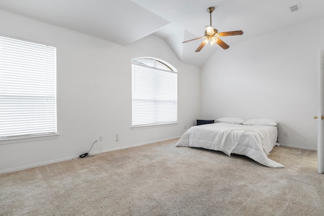 6716 Armstrong Ct, Fort Worth, TX 76137 - carpeted bedroom with multiple windows, vaulted ceiling, and a ceiling fan