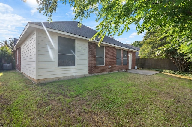 6716 Armstrong Ct, Fort Worth, TX 76137 - back of property with a patio, a shingled roof, and brick siding