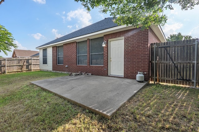 6716 Armstrong Ct, Fort Worth, TX 76137 - back of property featuring brick siding, a patio, a fenced backyard, and a shingled roof
