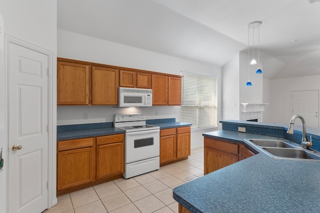 6716 Armstrong Ct, Fort Worth, TX 76137 - kitchen featuring white appliances, vaulted ceiling, light tile patterned floors, brown cabinets, and dark countertops