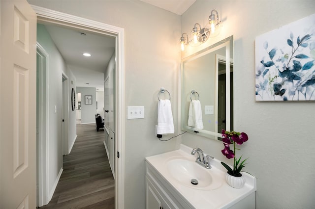 4817 Springsong Ln, Arlington, TX 76017 - bathroom with vanity, wood finished floors, and recessed lighting