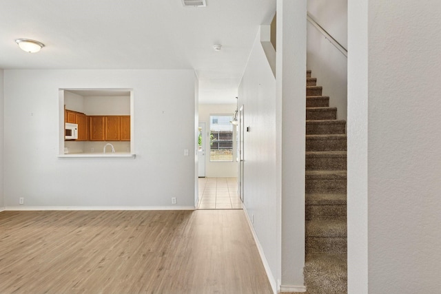 2609 Tilden Dr, Plano, TX 75074 - foyer featuring light wood-style flooring and stairs