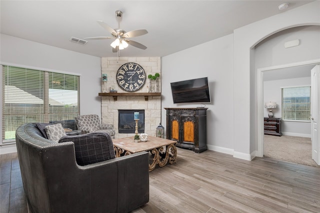 324 Roscoe Dr, Fate, TX 75087 - living room with ceiling fan, a fireplace, and wood finished floors