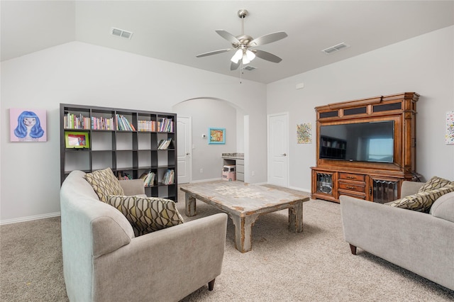324 Roscoe Dr, Fate, TX 75087 - living room with light colored carpet, arched walkways, ceiling fan, and lofted ceiling