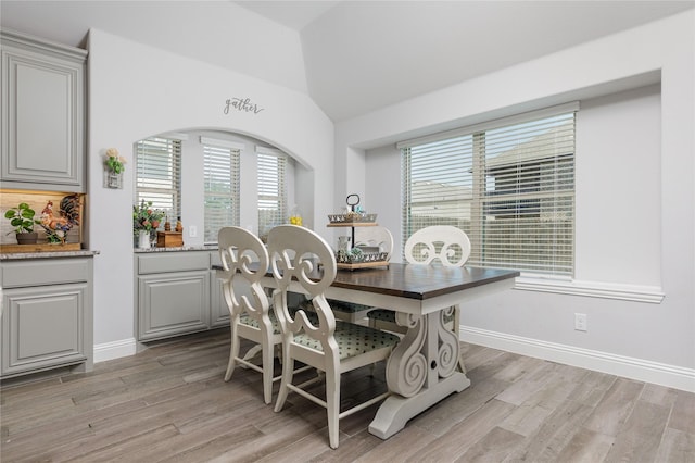 324 Roscoe Dr, Fate, TX 75087 - dining area with plenty of natural light, light wood-style flooring, and vaulted ceiling