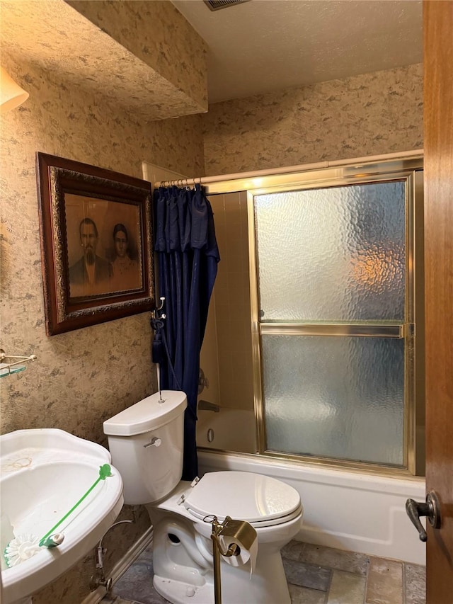 2312 Warm Springs Rd, Mesquite, TX 75149 - full bathroom with toilet and bath / shower combo with glass door