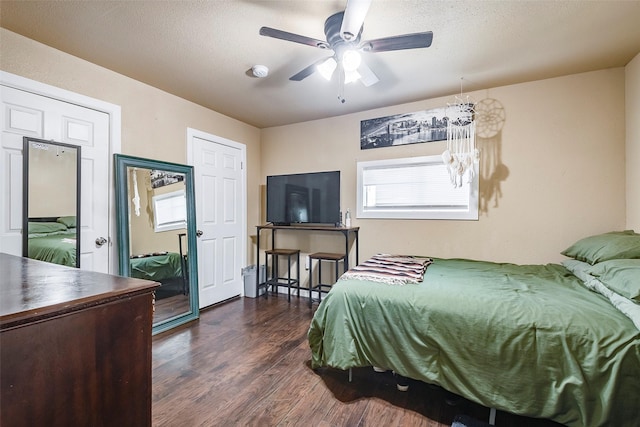 3624 Hardeman St, Fort Worth, TX 76119 - bedroom featuring dark wood-style flooring, multiple windows, and a ceiling fan
