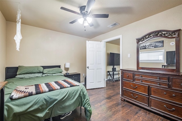 3624 Hardeman St, Fort Worth, TX 76119 - bedroom with dark wood-style flooring and a ceiling fan