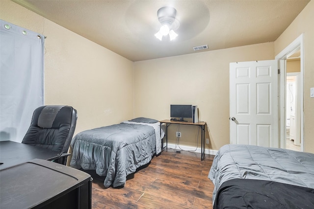 3624 Hardeman St, Fort Worth, TX 76119 - bedroom featuring wood finished floors, an office area, and a ceiling fan