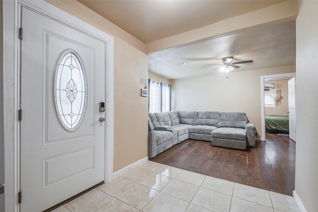 3624 Hardeman St, Fort Worth, TX 76119 - entrance foyer with ceiling fan and tile patterned flooring
