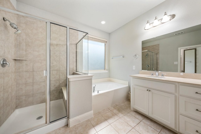 705 Rio Concho Trl, Mckinney, TX 75071 - full bath featuring a shower stall, a garden tub, vanity, and tile patterned floors