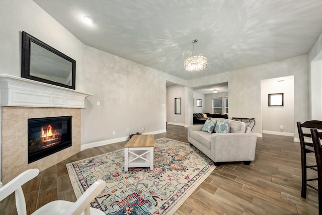 705 Rio Concho Trl, Mckinney, TX 75071 - living area with wood finished floors and a fireplace