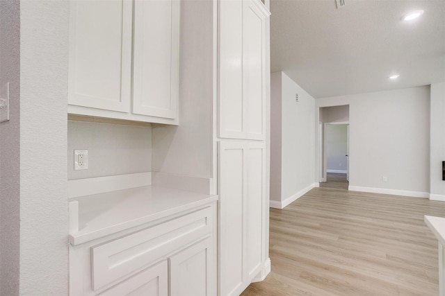 507 S 4th St, Grandview, TX 76050 - corridor featuring light wood-type flooring and recessed lighting