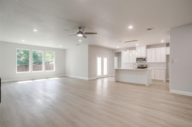 507 S 4th St, Grandview, TX 76050 - unfurnished living room featuring recessed lighting, ceiling fan, and light wood-style flooring