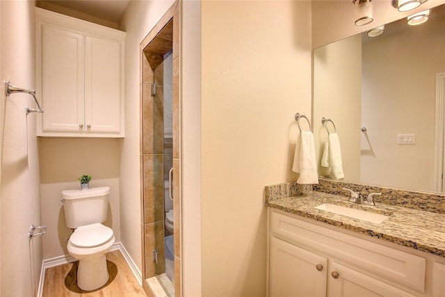 109 W Damon St, Terrell, TX 75160 - full bathroom with vanity, a stall shower, and wood finished floors