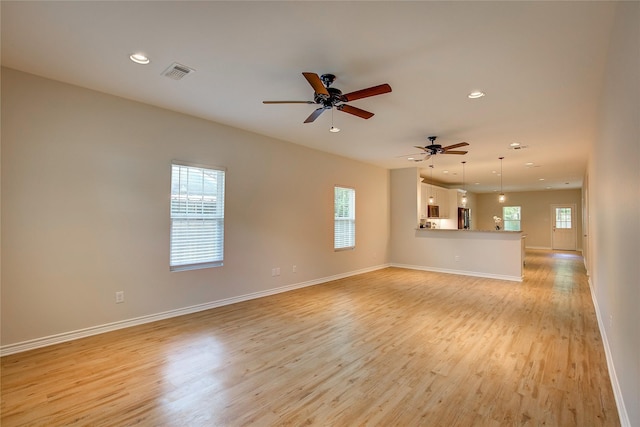 109 W Damon St, Terrell, TX 75160 - unfurnished living room with light wood-style flooring, recessed lighting, and ceiling fan