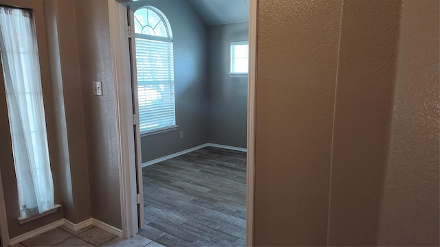 11521 Blanchard Dr, Frisco, TX 75035 - hallway with a textured wall, vaulted ceiling, and wood finished floors