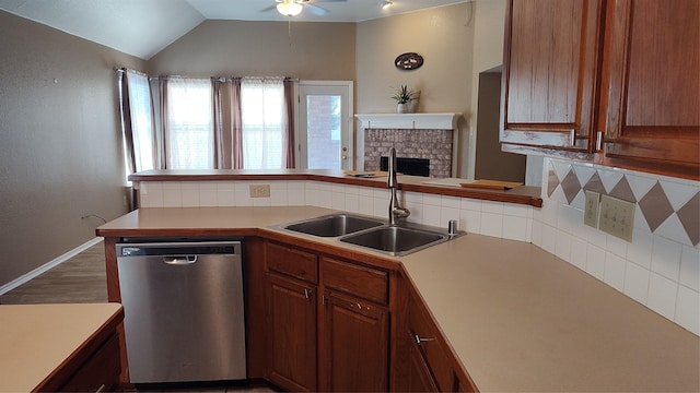 11521 Blanchard Dr, Frisco, TX 75035 - kitchen featuring stainless steel dishwasher, ceiling fan, backsplash, light countertops, and a fireplace