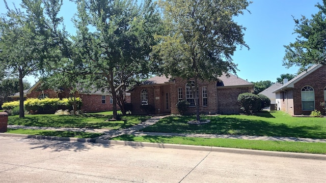 11521 Blanchard Dr, Frisco, TX 75035 - view of front of house with brick siding and a front yard