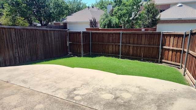 11521 Blanchard Dr, Frisco, TX 75035 - fenced backyard featuring a patio and an attached garage