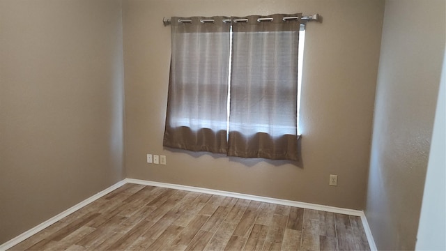 11521 Blanchard Dr, Frisco, TX 75035 - spare room featuring wood finished floors
