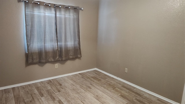 11521 Blanchard Dr, Frisco, TX 75035 - unfurnished room with wood finished floors and baseboards