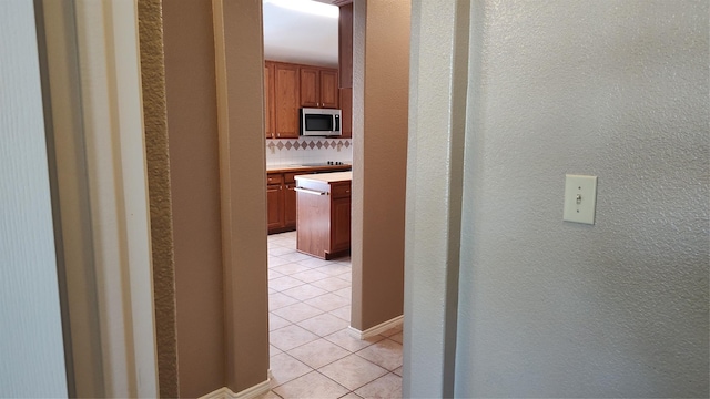 11521 Blanchard Dr, Frisco, TX 75035 - hall featuring light tile patterned floors and a textured wall