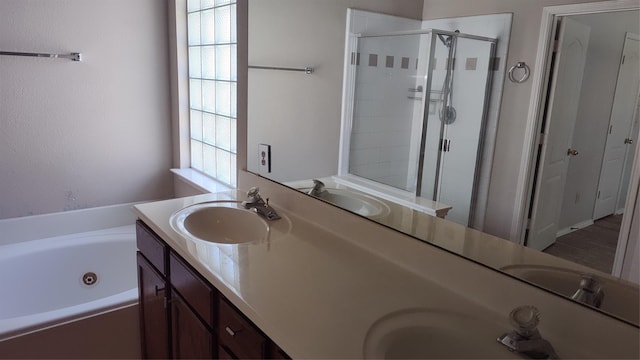 11521 Blanchard Dr, Frisco, TX 75035 - bathroom featuring double vanity, a shower stall, and a whirlpool tub
