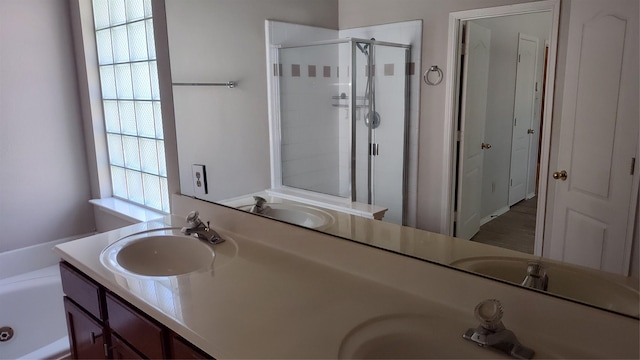 11521 Blanchard Dr, Frisco, TX 75035 - bathroom with a shower stall, double vanity, and a garden tub