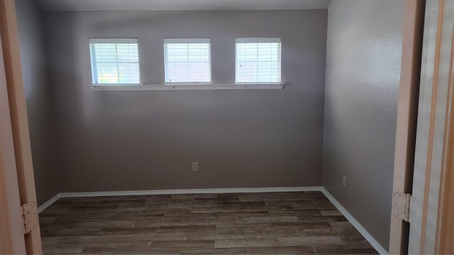11521 Blanchard Dr, Frisco, TX 75035 - empty room featuring healthy amount of natural light and wood finished floors
