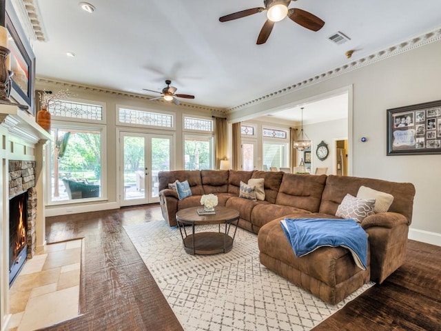 1908 Peninsula Dr, Flower Mound, TX 75022 - living room with a ceiling fan, a stone fireplace, french doors, and recessed lighting
