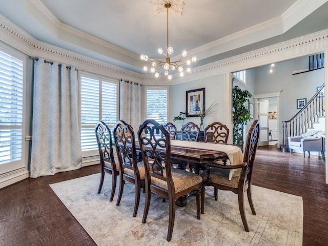 1908 Peninsula Dr, Flower Mound, TX 75022 - dining space featuring a chandelier, crown molding, a raised ceiling, wood finished floors, and stairs