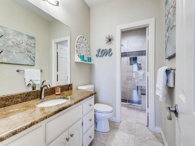 1908 Peninsula Dr, Flower Mound, TX 75022 - bathroom featuring vanity, a tile shower, and tile patterned flooring