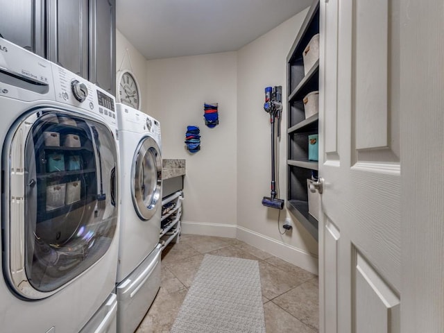 1908 Peninsula Dr, Flower Mound, TX 75022 - washroom featuring separate washer and dryer, cabinet space, and light tile patterned floors