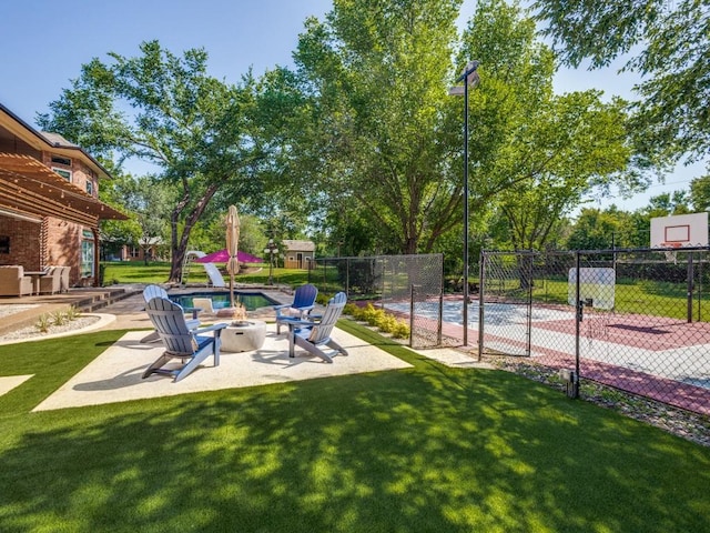 1908 Peninsula Dr, Flower Mound, TX 75022 - view of yard featuring a fire pit and a patio area