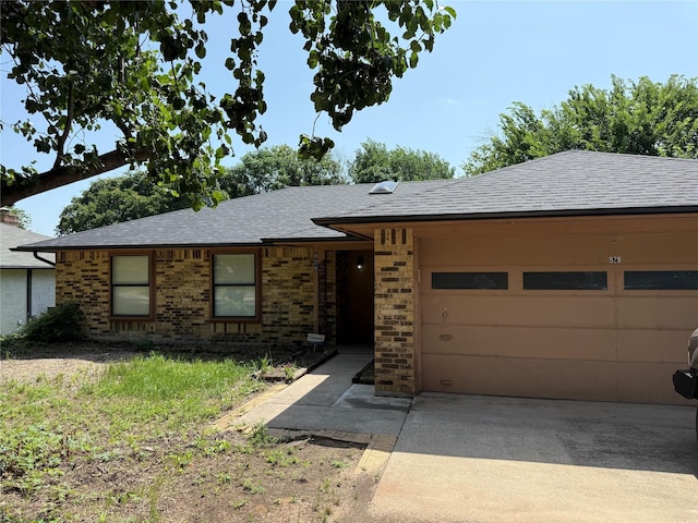 928 Rosebud Dr, Azle, TX 76020 - single story home with roof with shingles, a garage, brick siding, and concrete driveway