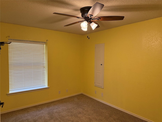 928 Rosebud Dr, Azle, TX 76020 - empty room featuring ceiling fan, dark colored carpet, a textured ceiling, and healthy amount of natural light