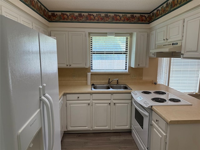 928 Rosebud Dr, Azle, TX 76020 - kitchen featuring white appliances, under cabinet range hood, light countertops, white cabinetry, and dark wood finished floors