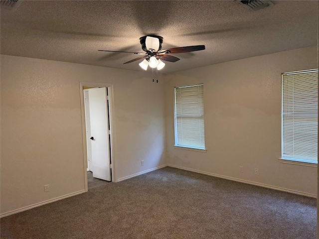 928 Rosebud Dr, Azle, TX 76020 - empty room with dark colored carpet, a ceiling fan, and a textured ceiling