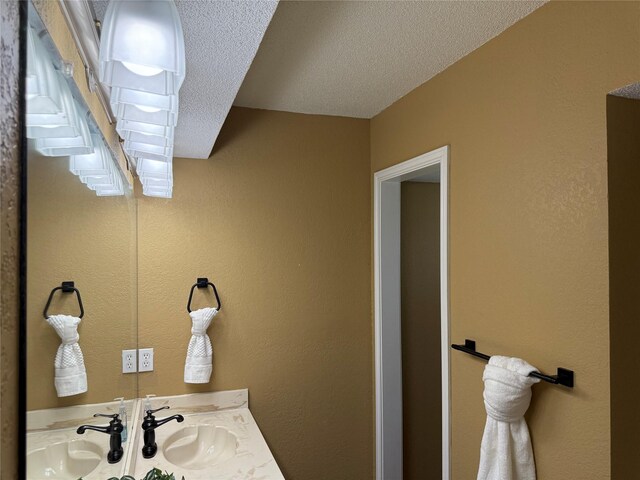 928 Rosebud Dr, Azle, TX 76020 - bathroom with a textured ceiling and vanity