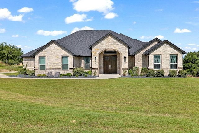 3036 Deer Ct, Weatherford, TX 76085 - french country home featuring stone siding and a front lawn