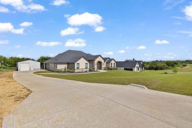 3036 Deer Ct, Weatherford, TX 76085 - french provincial home with a garage, concrete driveway, a front lawn, and an outdoor structure