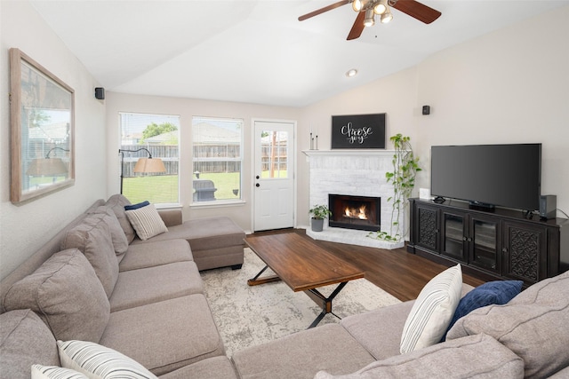 1722 Chestnut St, Anna, TX 75409 - living room with vaulted ceiling, ceiling fan, wood finished floors, and a brick fireplace