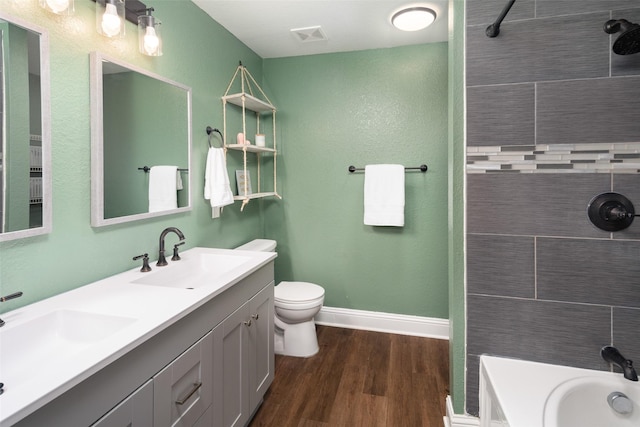1722 Chestnut St, Anna, TX 75409 - full bathroom featuring a tile shower, double vanity, wood finished floors, and a bathtub