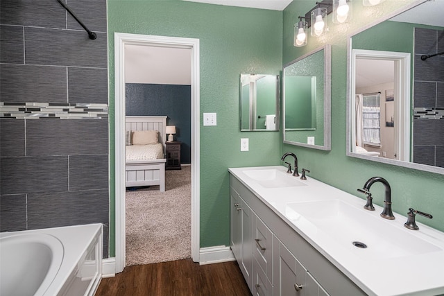 1722 Chestnut St, Anna, TX 75409 - bathroom with double vanity, wood finished floors, and bathing tub / shower combination