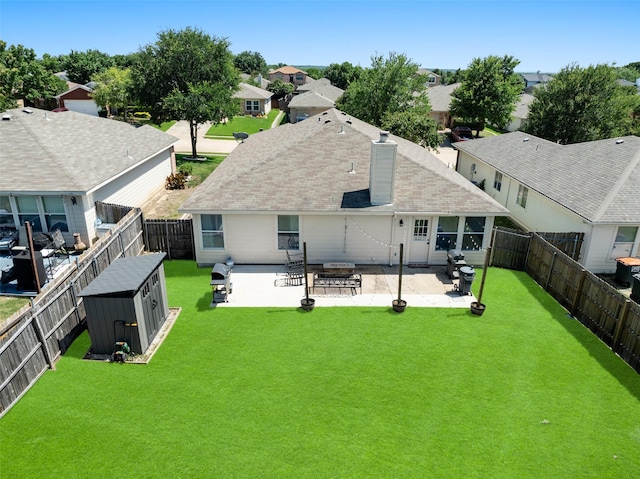1722 Chestnut St, Anna, TX 75409 - back of house with a patio area, a fenced backyard, a storage unit, a residential view, and a chimney