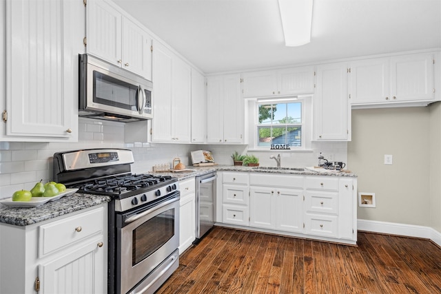 411 Harcourt St, Weatherford, TX 76086 - kitchen featuring appliances with stainless steel finishes, light stone countertops, and white cabinetry