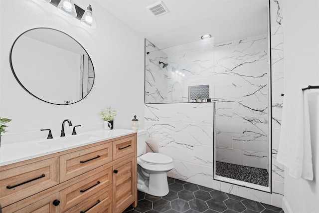 411 Harcourt St, Weatherford, TX 76086 - full bath featuring vanity, a marble finish shower, tile patterned flooring, and recessed lighting