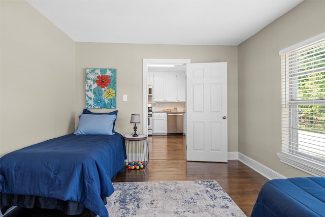 411 Harcourt St, Weatherford, TX 76086 - bedroom featuring dark wood-style flooring and baseboards